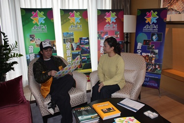 Representatives of Hong Kong Post Production Industry display information of services provided by the industry