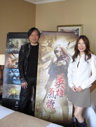 Director Takkie Yeung (left) displays the promotional materials of his film project in the meeting room