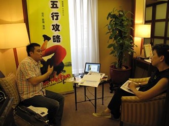 Director Casey Chan discusses her project with a Beijing film investor