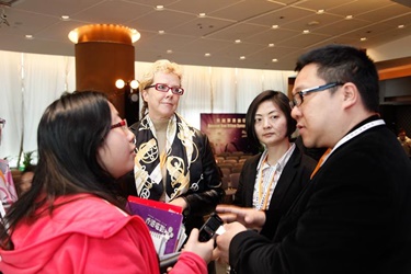 Participants exchange views with one of the guest speakers after the panel discussion