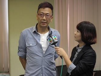 Hong Kong New Action Producer Lawrence Cheng is interviewed by local media about film and multi-media collaboration