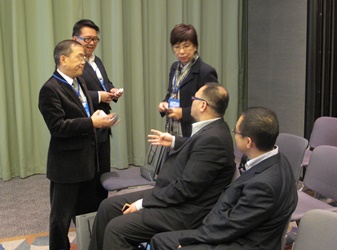 Hong Kong New Action Director Casey Chan (centre) meets guest speakers after a panel discussion