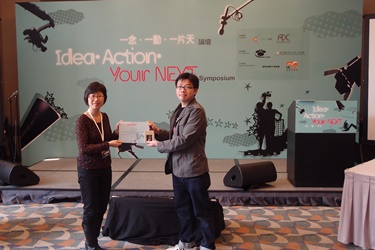 A Workshop participant is presented his attendance certificate