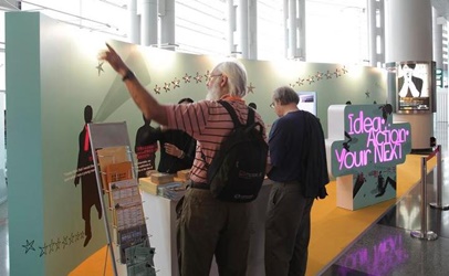 Overseas visitors make enquiries and collect publications at the Booth