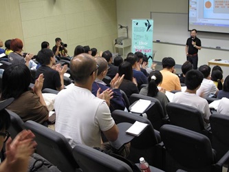 Participants respond enthusiastically at a seminar